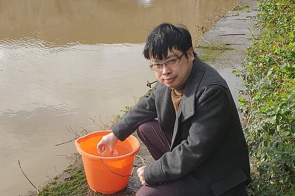 Nicholas collecting water sampling